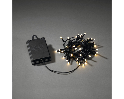 Ljusslinga KONSTSMIDE 40 varmvita frostade LED multifunktion timer 6h svart kabel 3,9m 4xAA